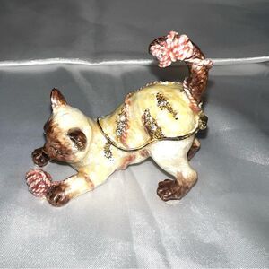 Playful Cat Figurine with Gold and Brown Accents